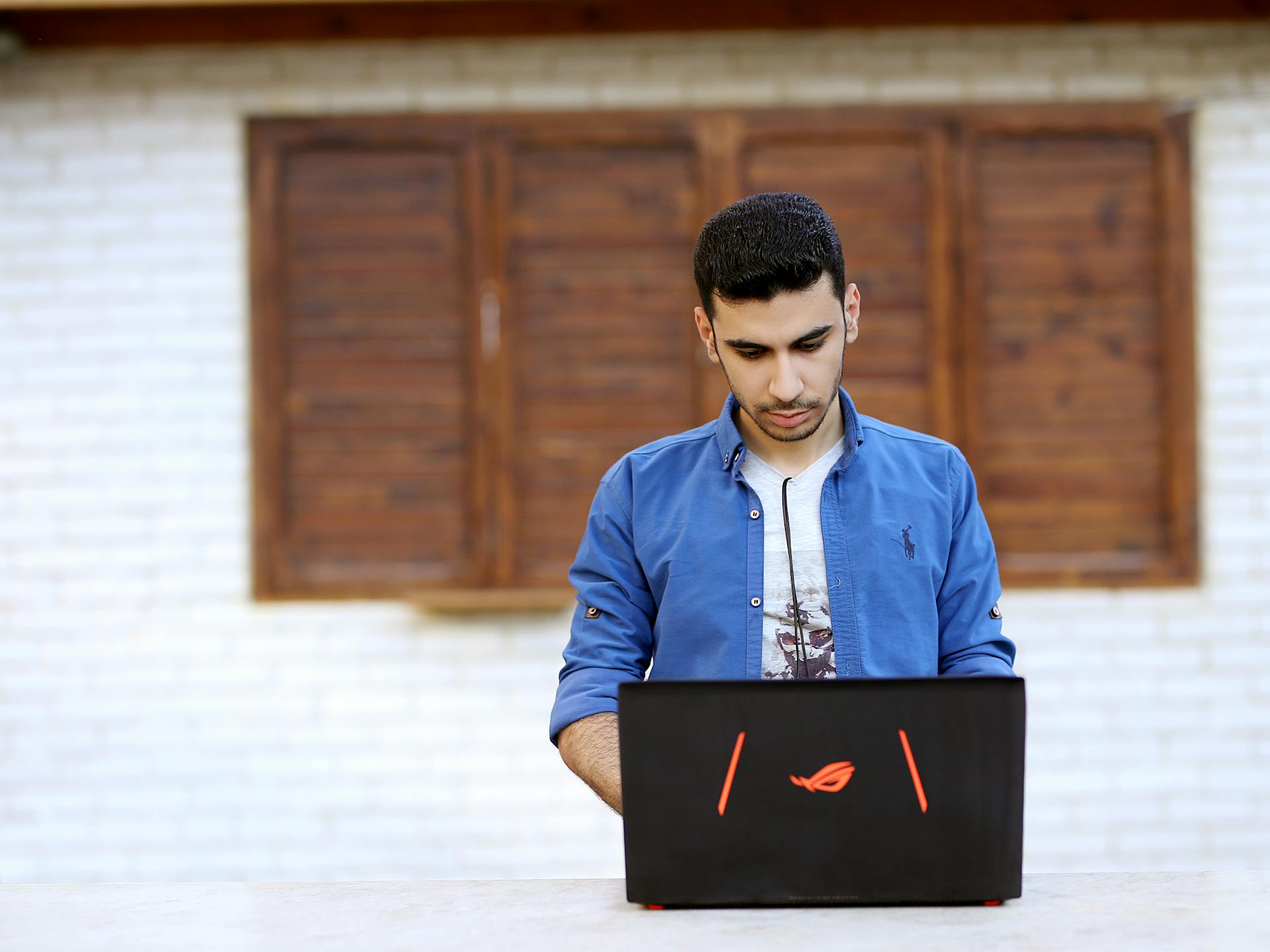 Ali Heydari in front of a laptop